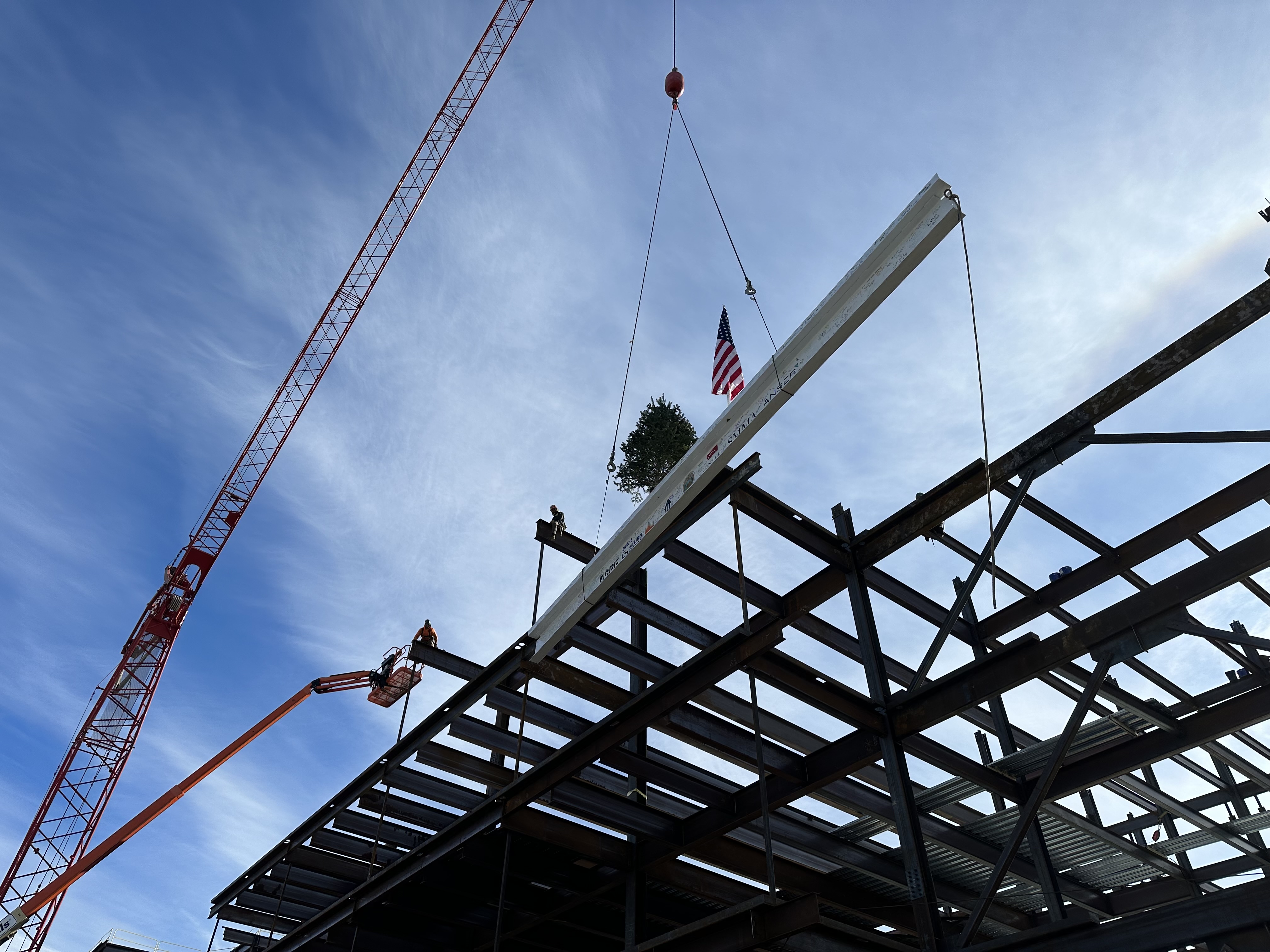 lowering the topping steel beam from a crane